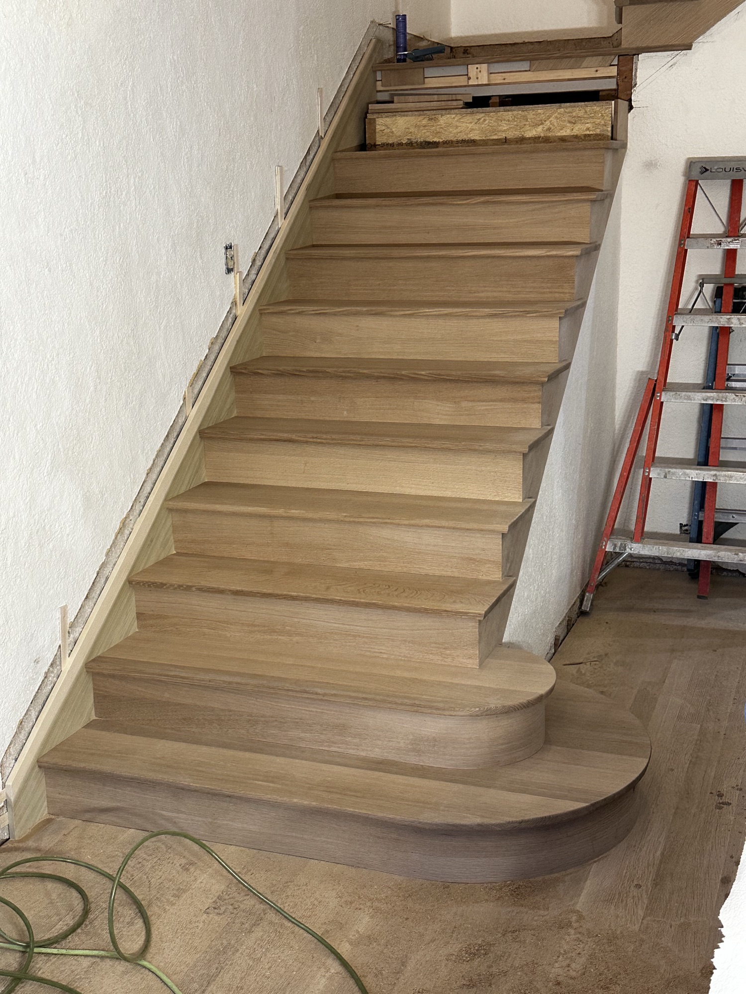 Curved white oak staircase landing