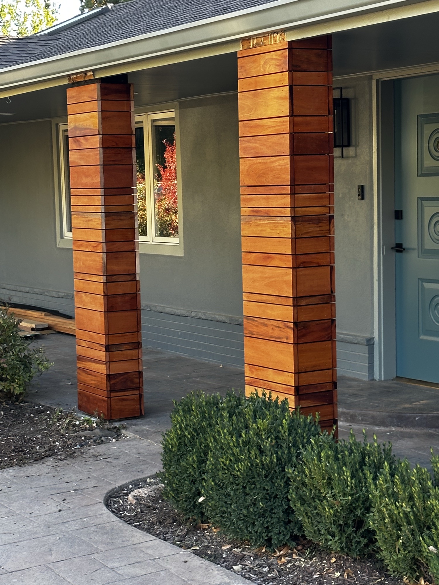 Ipe-wrapped entry columns ranch home